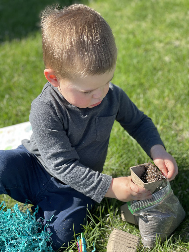 child-planting-seeds