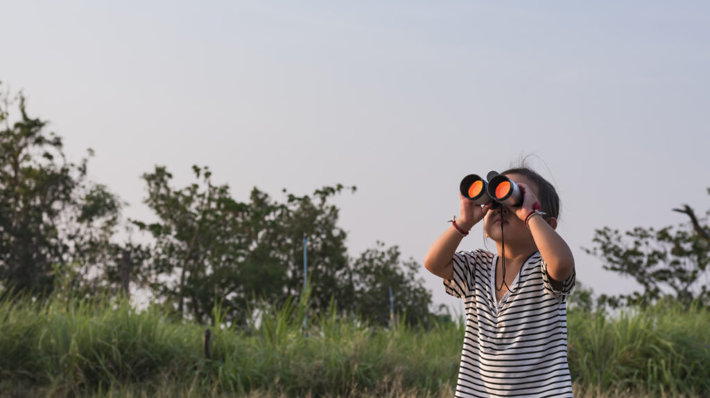 girl-looking-through-binoculars